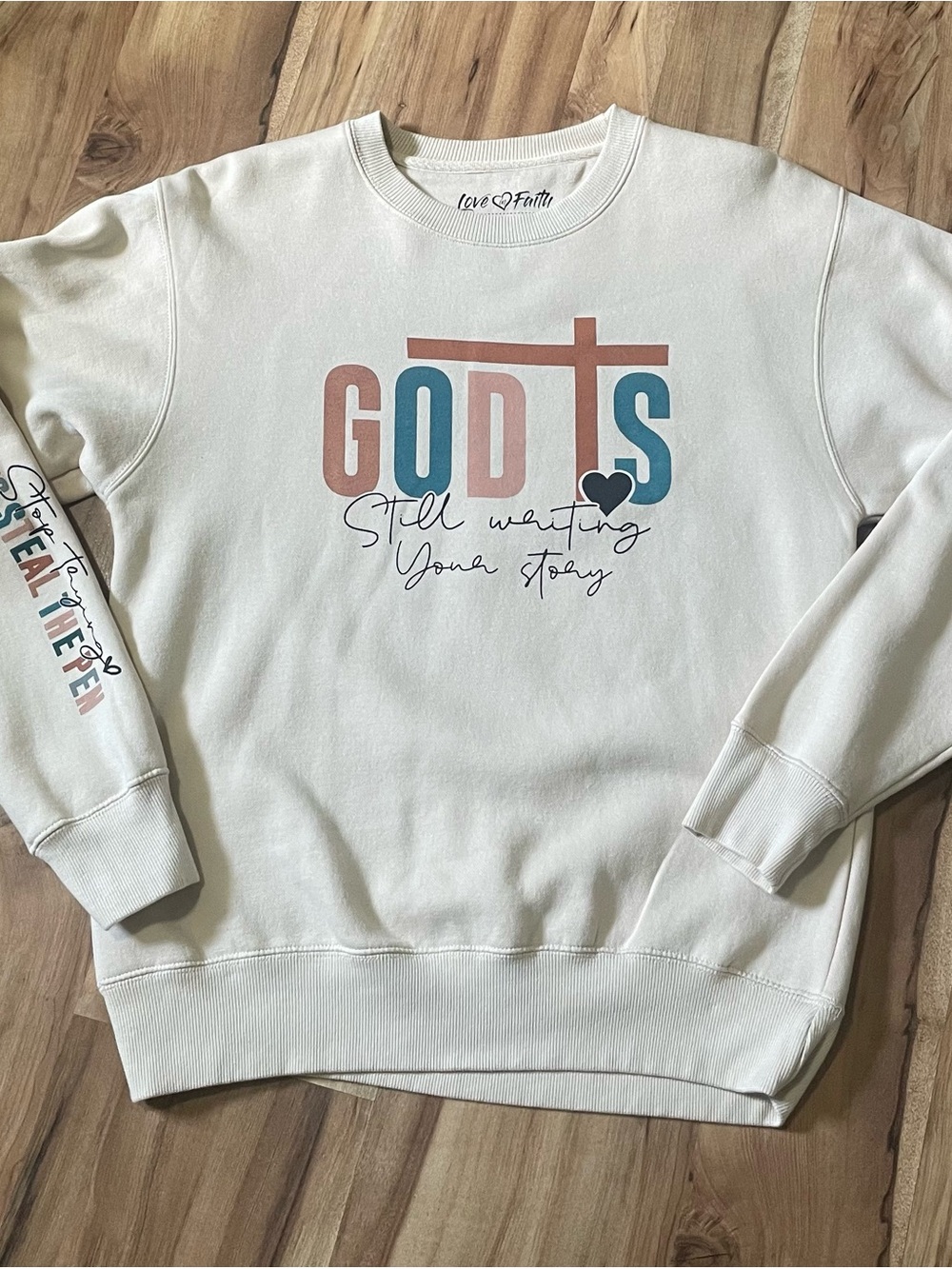 Love in Faith God Is Still Writing Your Story Graphic Sweatshirt Cream Size S